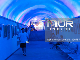 Citizens are cooling off in a bomb shelter as the high temperature continues in Chongqing, China, on July 21, 2024. (