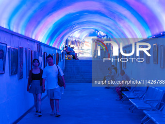 Citizens are cooling off in a bomb shelter as the high temperature continues in Chongqing, China, on July 21, 2024. (