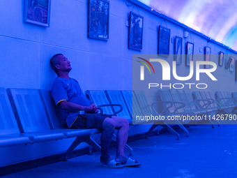 Citizens are cooling off in a bomb shelter as the high temperature continues in Chongqing, China, on July 21, 2024. (