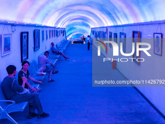 Citizens are cooling off in a bomb shelter as the high temperature continues in Chongqing, China, on July 21, 2024. (