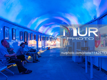 Citizens are cooling off in a bomb shelter as the high temperature continues in Chongqing, China, on July 21, 2024. (