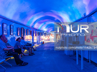 Citizens are cooling off in a bomb shelter as the high temperature continues in Chongqing, China, on July 21, 2024. (