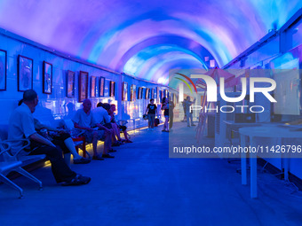 Citizens are cooling off in a bomb shelter as the high temperature continues in Chongqing, China, on July 21, 2024. (