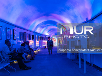 Citizens are cooling off in a bomb shelter as the high temperature continues in Chongqing, China, on July 21, 2024. (