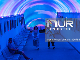 Citizens are cooling off in a bomb shelter as the high temperature continues in Chongqing, China, on July 21, 2024. (