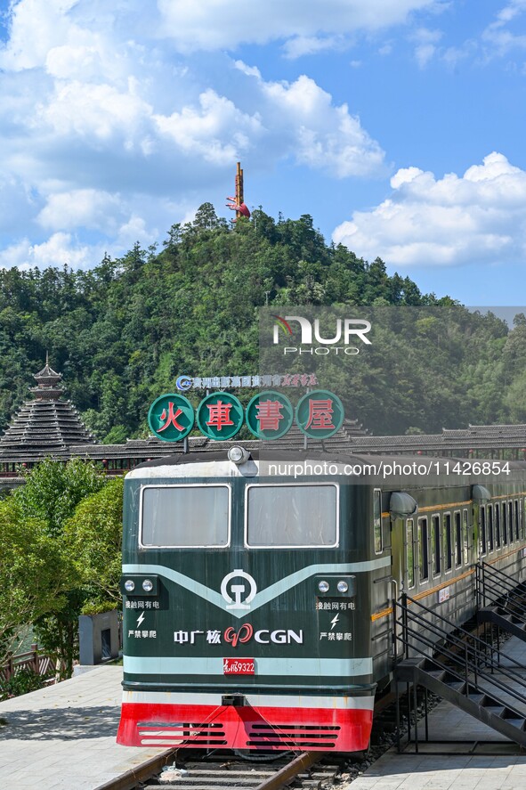 Students are reading in a green lacquered ''train book house'' in Yuping county, Guizhou province, China, on July 21, 2024. 