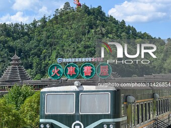 Students are reading in a green lacquered ''train book house'' in Yuping county, Guizhou province, China, on July 21, 2024. (