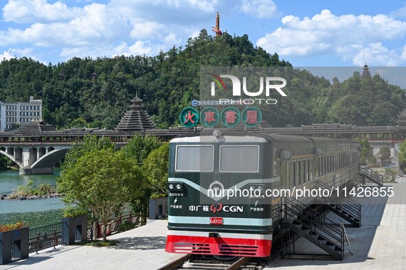 Students are reading in a green lacquered ''train book house'' in Yuping county, Guizhou province, China, on July 21, 2024. 