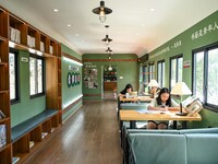 Students are reading in a green lacquered ''train book house'' in Yuping county, Guizhou province, China, on July 21, 2024. (