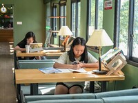 Students are reading in a green lacquered ''train book house'' in Yuping county, Guizhou province, China, on July 21, 2024. (