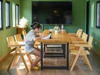 Students are reading in a green lacquered ''train book house'' in Yuping county, Guizhou province, China, on July 21, 2024. (