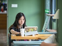 Students are reading in a green lacquered ''train book house'' in Yuping county, Guizhou province, China, on July 21, 2024. (