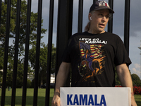 A man is wearing a shirt with the words ''Let's Go Kamala'' to support the Democratic Party's new nominee Kamala Harris in front of the Whit...