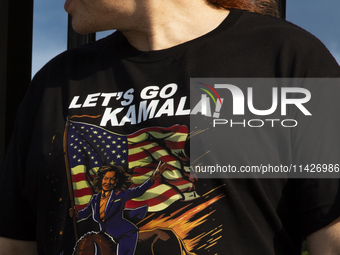 A man is wearing a shirt with the words ''Let's Go Kamala'' to support the Democratic Party's new nominee Kamala Harris in front of the Whit...