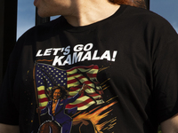 A man is wearing a shirt with the words ''Let's Go Kamala'' to support the Democratic Party's new nominee Kamala Harris in front of the Whit...