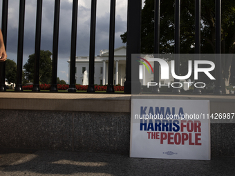 A sign with the words ''Kamala Harris For The People'' is being seen in front of the White House in Washington, DC, USA, on July 21, 2024. J...