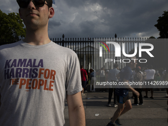 A man is wearing a shirt with the words ''Kamala Harris For The People'' to support the Democratic Party's new nominee Kamala Harris in fron...