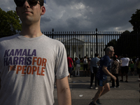 A man is wearing a shirt with the words ''Kamala Harris For The People'' to support the Democratic Party's new nominee Kamala Harris in fron...