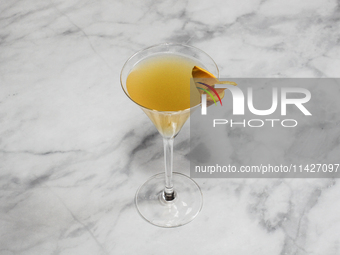 A cocktail ''Sidecar'' is sitting on a bright background. (