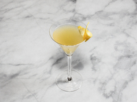 A cocktail ''Whiskey Sour'' is sitting on a bright background. (