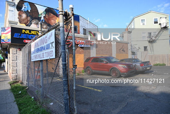 A person is being knocked unconscious during a fight, and the suspect is being arrested in Newark, New Jersey, United States, on July 21, 20...