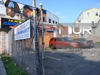 A person is being knocked unconscious during a fight, and the suspect is being arrested in Newark, New Jersey, United States, on July 21, 20...