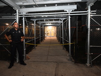 A police officer is guarding the crime scene. A man is being shot in the head and killed in Bronx, New York, United States, on July 21, 2024...