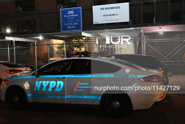 A police vehicle is at the crime scene. A man is being shot in the head and killed in Bronx, New York, United States, on July 21, 2024. At a...