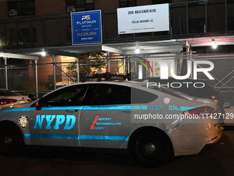 A police vehicle is at the crime scene. A man is being shot in the head and killed in Bronx, New York, United States, on July 21, 2024. At a...