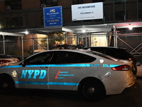 A police vehicle is at the crime scene. A man is being shot in the head and killed in Bronx, New York, United States, on July 21, 2024. At a...