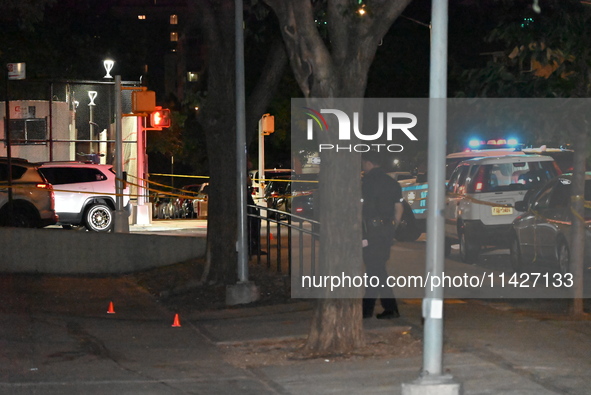 Evidence cones are at the scene. A male is in critical condition after being shot in an apartment building in Bronx, New York, United States...