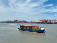 A large container ship is leaving the dock at Yangshan Port in Shanghai, China, on July 21, 2024. (