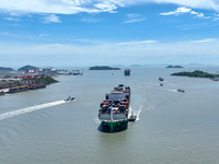 Large container ships are traveling to and from Yangshan Port in Shanghai, China, on July 21, 2024. (