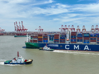 Large container ships are traveling to and from Yangshan Port in Shanghai, China, on July 21, 2024. (