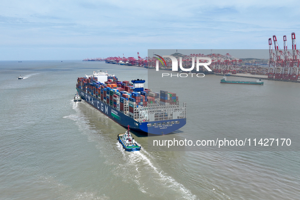 Large container ships are traveling to and from Yangshan Port in Shanghai, China, on July 21, 2024. 