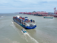 Large container ships are traveling to and from Yangshan Port in Shanghai, China, on July 21, 2024. (