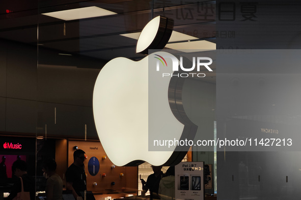 Customers are trying on and learning about Apple Vision Pro headsets at an Apple store in Shanghai, China, on July 22, 2024. 