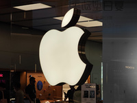 Customers are trying on and learning about Apple Vision Pro headsets at an Apple store in Shanghai, China, on July 22, 2024. (