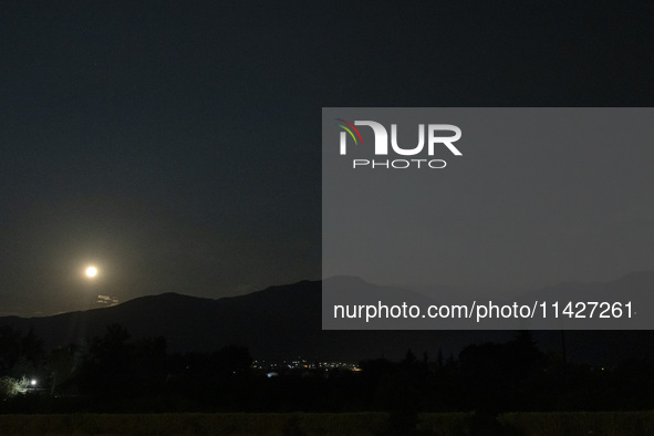 The Full Moon of July 2024 known as Buck Moon or Thunder Moon spotted over Mount Olympus in Greece. Mount Olympus is a National Park with th...