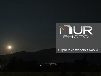 The Full Moon of July 2024 known as Buck Moon or Thunder Moon spotted over Mount Olympus in Greece. Mount Olympus is a National Park with th...