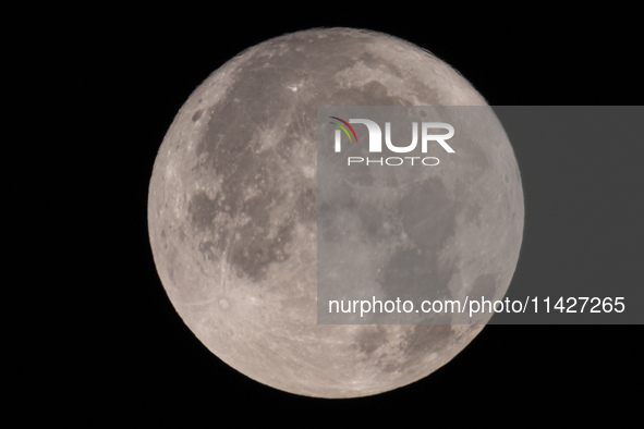 Close up of  the Full Moon of July 2024 known as Buck Moon or Thunder Moon spotted over Mount Olympus in Greece. Mount Olympus is a National...