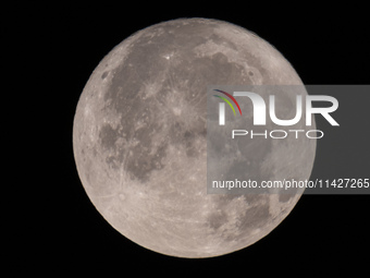 Close up of  the Full Moon of July 2024 known as Buck Moon or Thunder Moon spotted over Mount Olympus in Greece. Mount Olympus is a National...