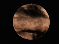 The Full Moon of July 2024 known as Buck Moon or Thunder Moon spotted behind clouds over Mount Olympus in Greece. Mount Olympus is a Nationa...