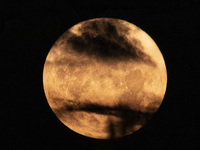 The Full Moon of July 2024 known as Buck Moon or Thunder Moon spotted behind clouds over Mount Olympus in Greece. Mount Olympus is a Nationa...