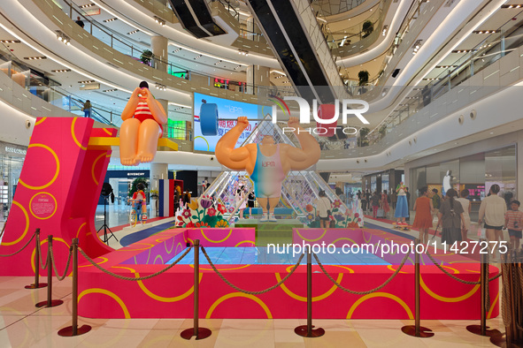 A shopping mall is turning its atrium into a cartoon arena to host a series of events for the upcoming Paris Olympic Games in Shanghai, Chin...