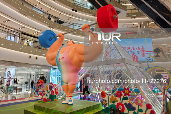 A shopping mall is turning its atrium into a cartoon arena to host a series of events for the upcoming Paris Olympic Games in Shanghai, Chin...