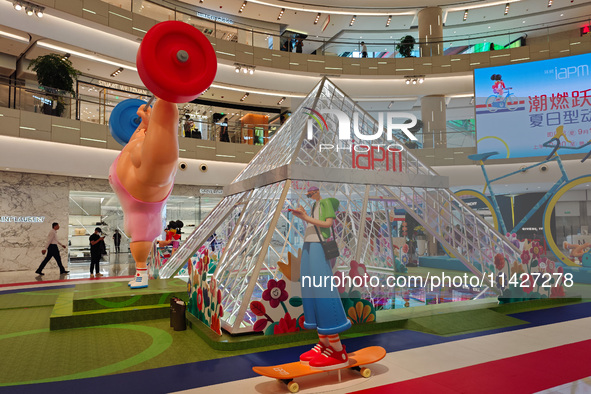 A shopping mall is turning its atrium into a cartoon arena to host a series of events for the upcoming Paris Olympic Games in Shanghai, Chin...