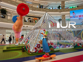 A shopping mall is turning its atrium into a cartoon arena to host a series of events for the upcoming Paris Olympic Games in Shanghai, Chin...