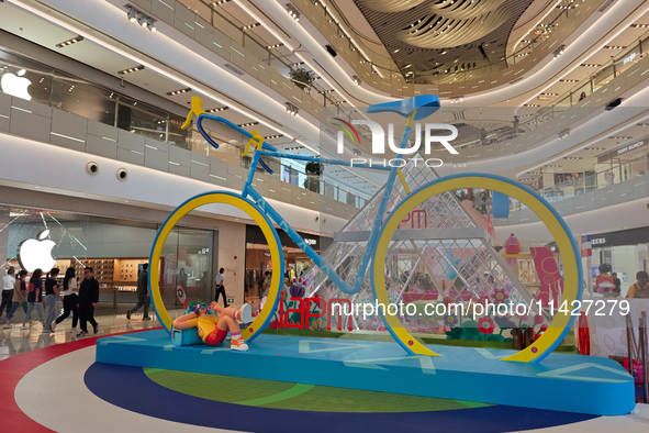 A shopping mall is turning its atrium into a cartoon arena to host a series of events for the upcoming Paris Olympic Games in Shanghai, Chin...