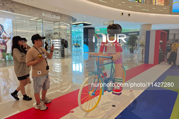 A shopping mall is turning its atrium into a cartoon arena to host a series of events for the upcoming Paris Olympic Games in Shanghai, Chin...